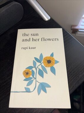 The Sun and Her Flowers — Cream Cover with Blue & Yellow Floral Art